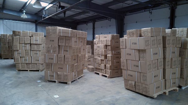 Pallets of TV wall mounts in the FireFold warehouse.