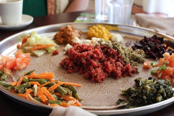 Insanely delicious platter of yummy kitfo (center, spiced raw beef) with veggies at Walia Ethiopian in Takoma Park, MD