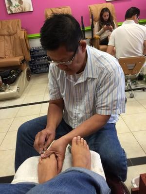 A man doing my toes!