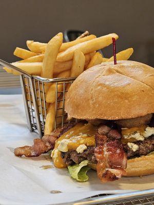 Close-up of the I'm So Bleu Burger and fries.