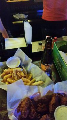 Wings, fries, anf beer.