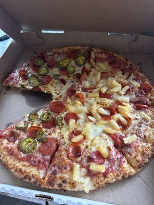 Pepperoni pizza with jalapeños and pineapple