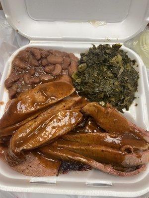 Two Meat Plate (w/ 2 sides): Brisket, Sausage, Mustard Greens, Red Beans and Rice.