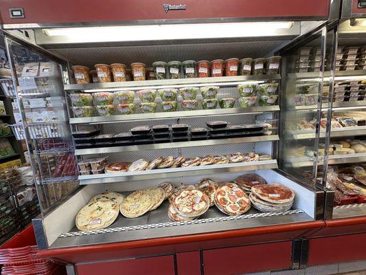 Display case pizzas