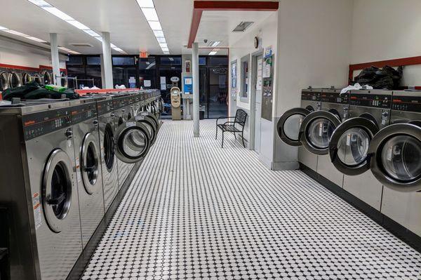 One row of many different sizes front-loading washers.