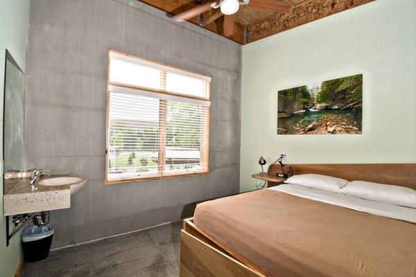 Private room with pillow-top queen bed, ceiling fan, handmade sink and keycard access