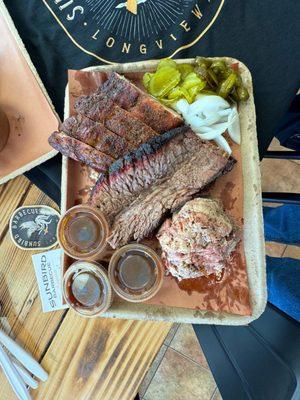 Tray of moist sliced brisket pork ribs and pulled pork