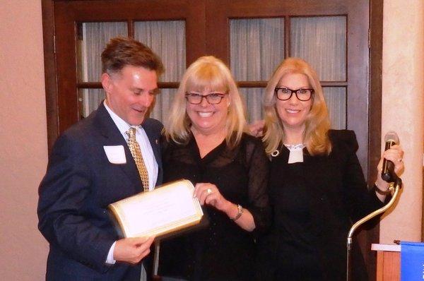 Paul Larson acknowledged by Millbrae Chamber Board Chair Mary Ellen Pellegrini and President Lorianne Richardson.