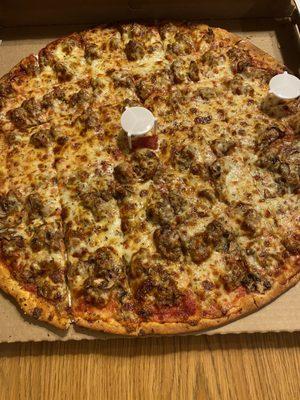 Family size- super thin sausage pizza and half with mushrooms.