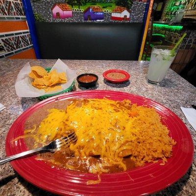 Three beef enchiladas with a mojito.