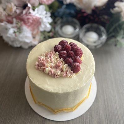 Lemon Raspberry Cake with fresh raspberries, homemade lemon curd, and candied lemon slices