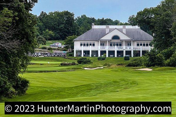 A view of the clubhouse overlooking the 18th green on July 12, 2023.