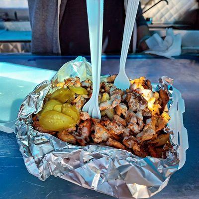 CHICKEN Shawarma loaded bowl over seasoned fries.