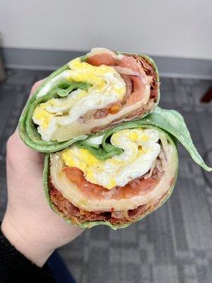 bacon, egg & cheese with veggies on a spinach wrap