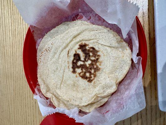 Tortilla's hecho a mano (literally hand patted). 4 with your meal. So much better than factory made.