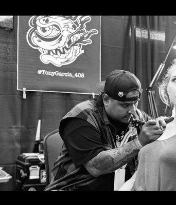 Action shot of me tattooing at the Northern Arizona Tattoo Festival in Prescott AZ 2019