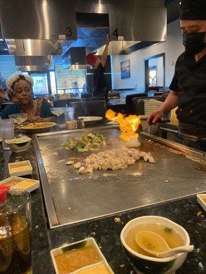 Hibachi chef showing all the fun skills! Onion volcano!