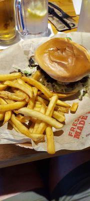 Swiss cheese, mushrooms,  and onions burger, and French fries.