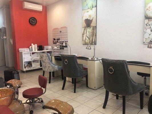 4 pedi chairs and 4 nail stations.