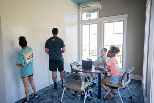 Group and private study rooms. Yes, you can write on the walls :)