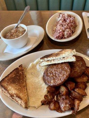 Clockwise: homemade hash browns, 2 eggs with sausage and baked beans