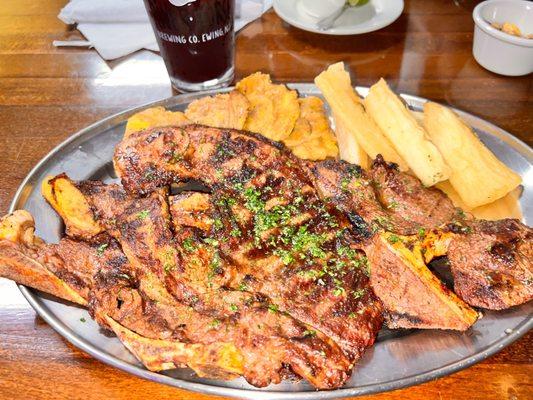 Churrasco with tostones and fried yuca