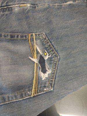 Ripped pant pocket