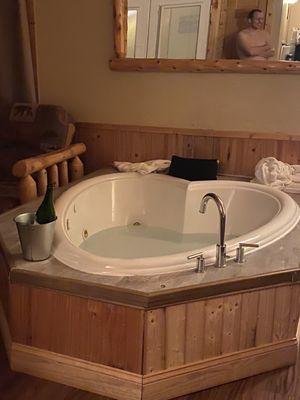 The adorable heart shaped jacuzzi with our chilled champagne ready to go.