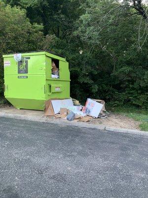 Trash always overflowing, strewn across the road