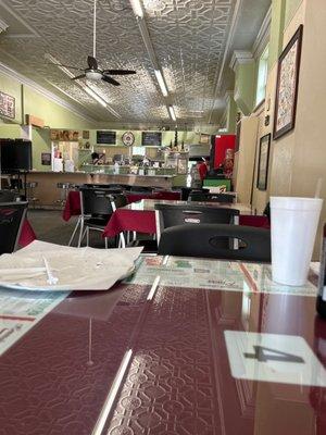 Counter area to sit or order food to go. You can see where they prepare the food.