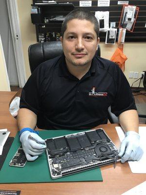 Camilo Repairing a Laptop - Phone Repair Tech