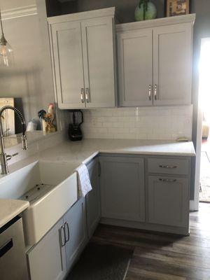 Custom soft close cabinets, farmhouse sink, large lazy Susan, pull out trash, recycling bins.