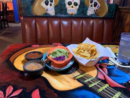 Guacamole, salsa and beans with chips - yum!