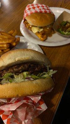 Burger and Mushroom grilled chicken burger with side of fries and jalapeños.