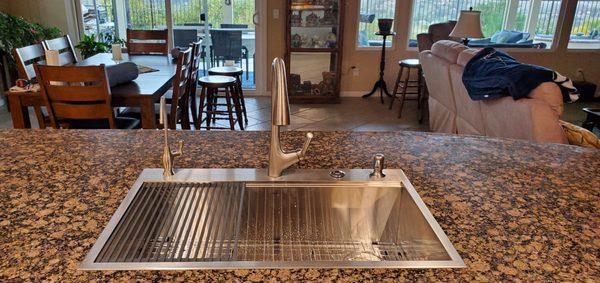 Beautiful new sink.  Will has the skill to cut the granite to put a rectangular sink in a hole that was oblong.