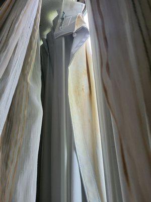 Torn & stained drapes