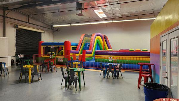 Bouncer area, with small area for up-to-5-yo, and larger area for all ages. (No adults on bouncers, though!)