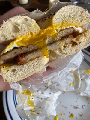 Sausage egg and cheese with a has brown, over easy egg