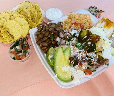 Pork Tamale plate with everything on it. Comes with 3 house made tamales.