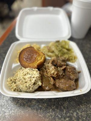 Oxtails w/ cajun rice, mac'n cheese, cabbage, and cornbread