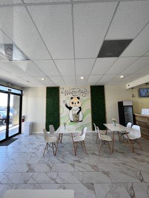 Beautiful panda mural and tables