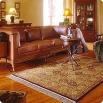 Oriental Rug, Leather Sofa, @ Drapes