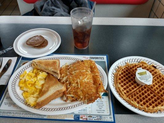 All Star Special with Waffle. 2 scrambled eggs, toast, Double Hash Browns, and Sausage patties.