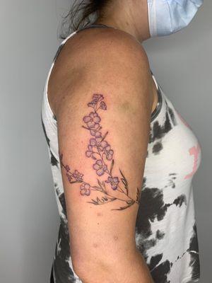 Delicate and beautiful larkspur tattoo