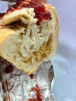 Inside the Pilgrim-fresh sliced real turkey breast, stuffing and cranberry sauce-Thanksgiving on a roll!