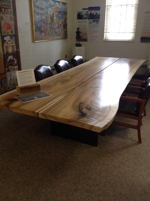 Look at this beautiful repurposed table from local trees!