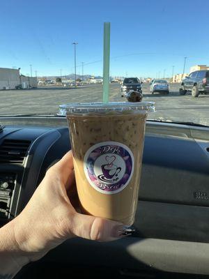 Iced White Chocolate Mocha with Hazelnut topped with a chocolate covered coffee bean