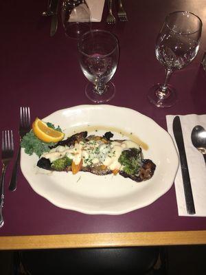 10oz choice NY strip steak topped with roasted broccoli and peppers, and a crumbly blue cheese sauce.