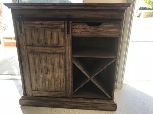 THIS IS A BEAUTIFUL PIECE FOR YOUR ENTERTAINMENT ROOM!  IF YOU LOVE A RUSTIC KIND OF LOOK YOU'LL LOVE THIS .  COME TAKE A LOOK FOR YOURSELF.