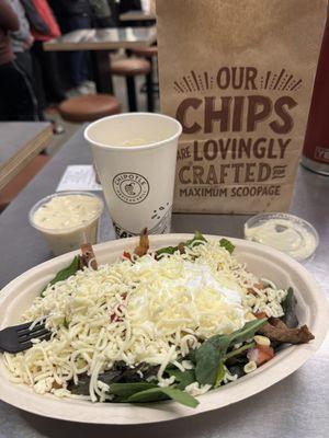 My salad, chips with queso blanco, and a water cup.